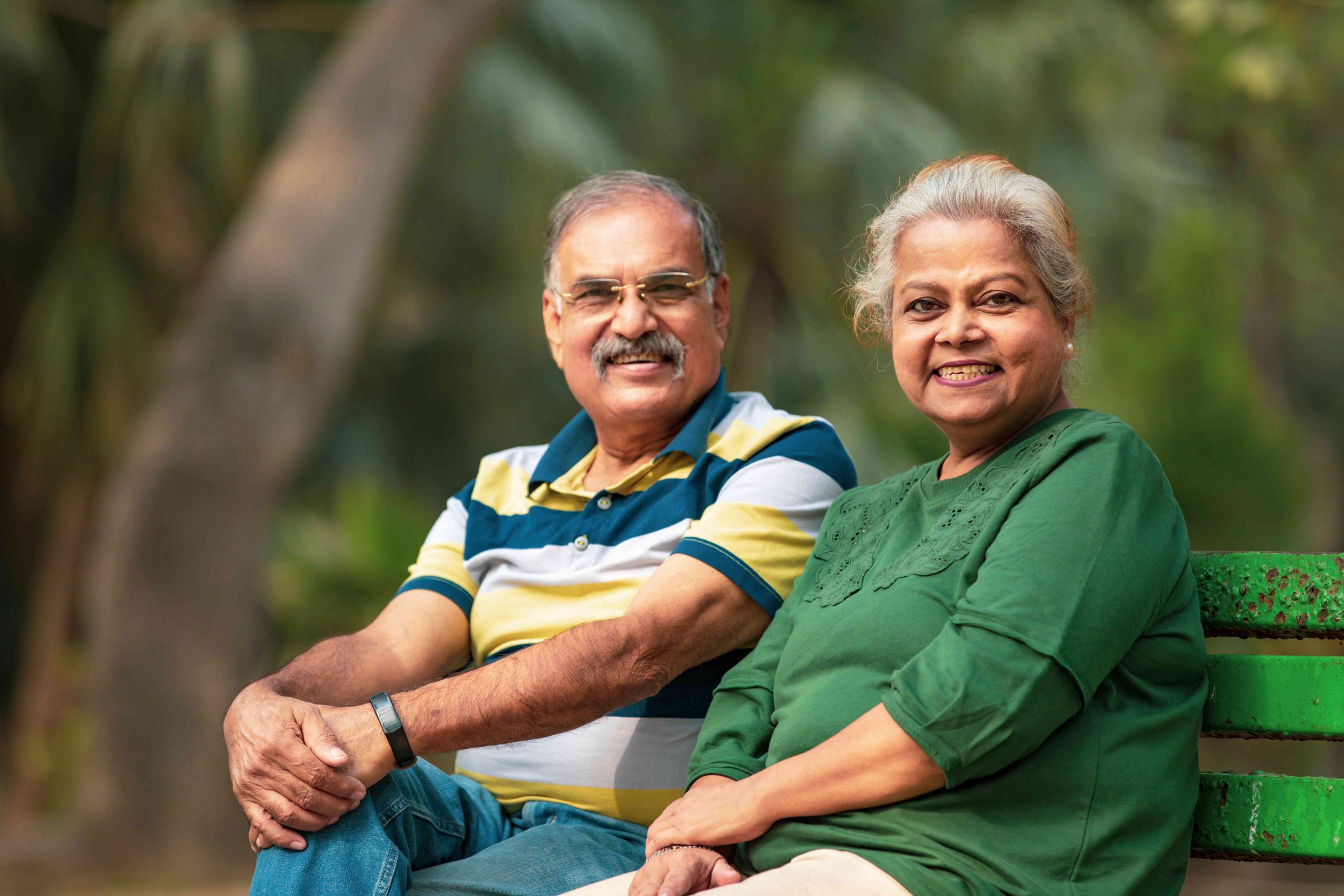 An older couple smiling and considering income advantage as a loan option